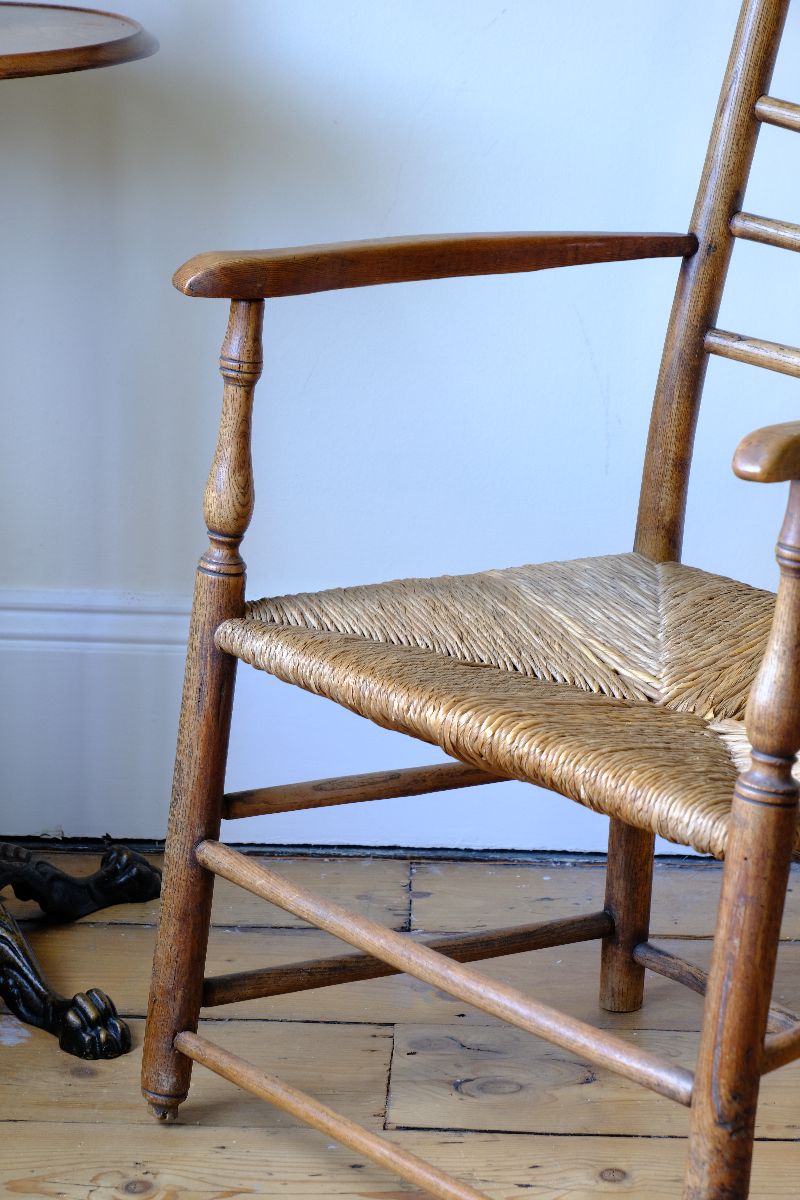 Turned leg detail on a Stamped upright  on a Philip Clissett Spindle Back Armchair Herefordshire Circa 1890Philip Clissett Spindle Back Armchair Herefordshire Circa 1890