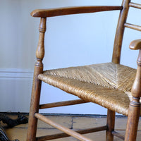 Turned leg detail on a Stamped upright  on a Philip Clissett Spindle Back Armchair Herefordshire Circa 1890Philip Clissett Spindle Back Armchair Herefordshire Circa 1890