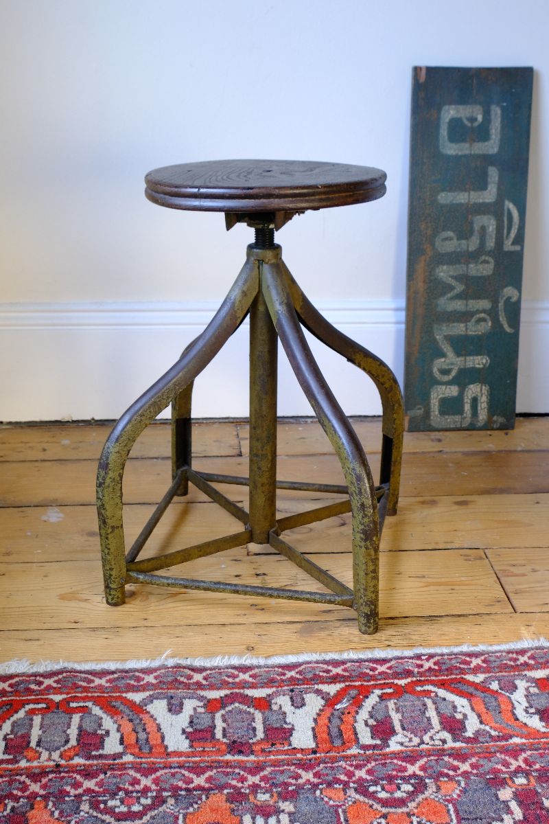 Paint detail on a aged and worn Industrial Swivel Stool Circa 1950 | Vintage Elm & Steel Workshop Stool