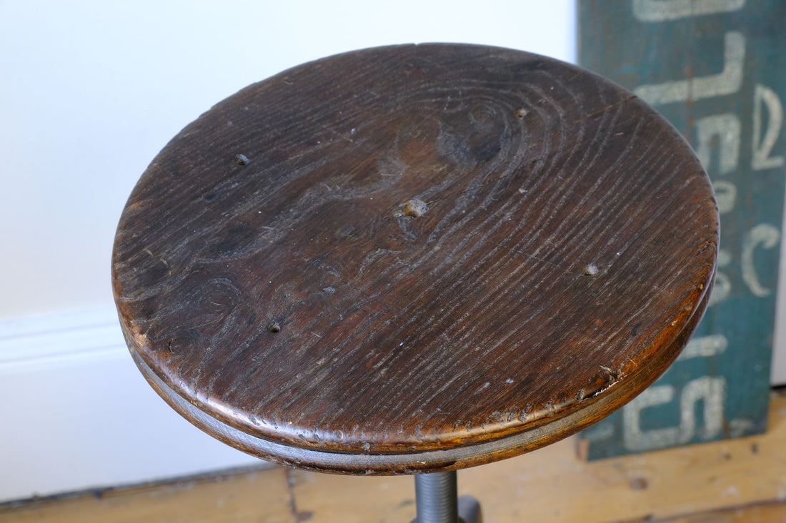 close up of the elm seat on a Industrial Swivel Stool Circa 1950 | Vintage Elm & Steel Workshop Stool