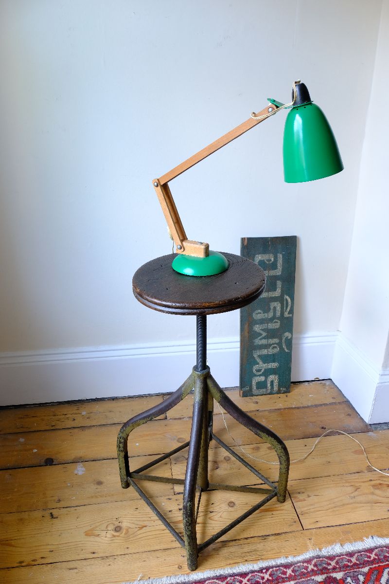 Shown with a lamp on an Industrial Swivel Stool Circa 1950 | Vintage Elm & Steel Workshop Stool 