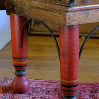 The surviving original terracotta polychrome decoration 
 on a Late 19th Century Gujarati Hardwood Hall Bench with Original Polychrome Finish, Turned Gallery Back and Brass Rosette Mounts