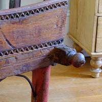 Side finial on a Late 19th Century Gujarati Hardwood Hall Bench with Original Polychrome Finish, Turned Gallery Back and Brass Rosette Mounts