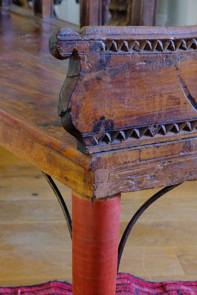 Close up detailed arm on a Late 19th Century Gujarati Hardwood Hall Bench with Original Polychrome Finish, Turned Gallery Back and Brass Rosette Mounts