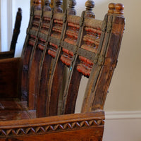 Side profile view showing the curved agronomical back on a on a Late 19th Century Gujarati Hardwood Hall Bench with Original Polychrome Finish, Turned Gallery Back and Brass Rosette Mounts
