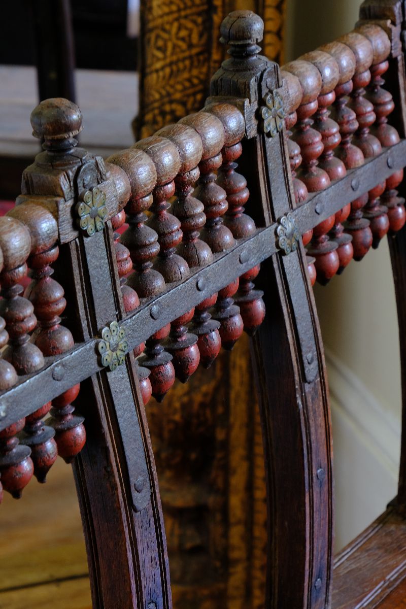 The extraordinary turned spindle gallery 
- Late 19th Century Gujarati Hardwood Hall Bench with Original Polychrome Finish, Turned Gallery Back and Brass Rosette Mounts