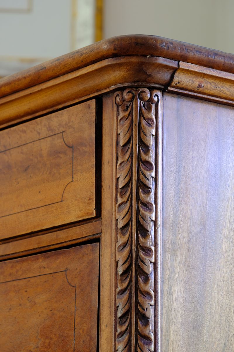 Curved corner top and carved pilaster on the Camphor Wood Campaign Secretaire Chest by Phelps Ltd., c.1890–1915