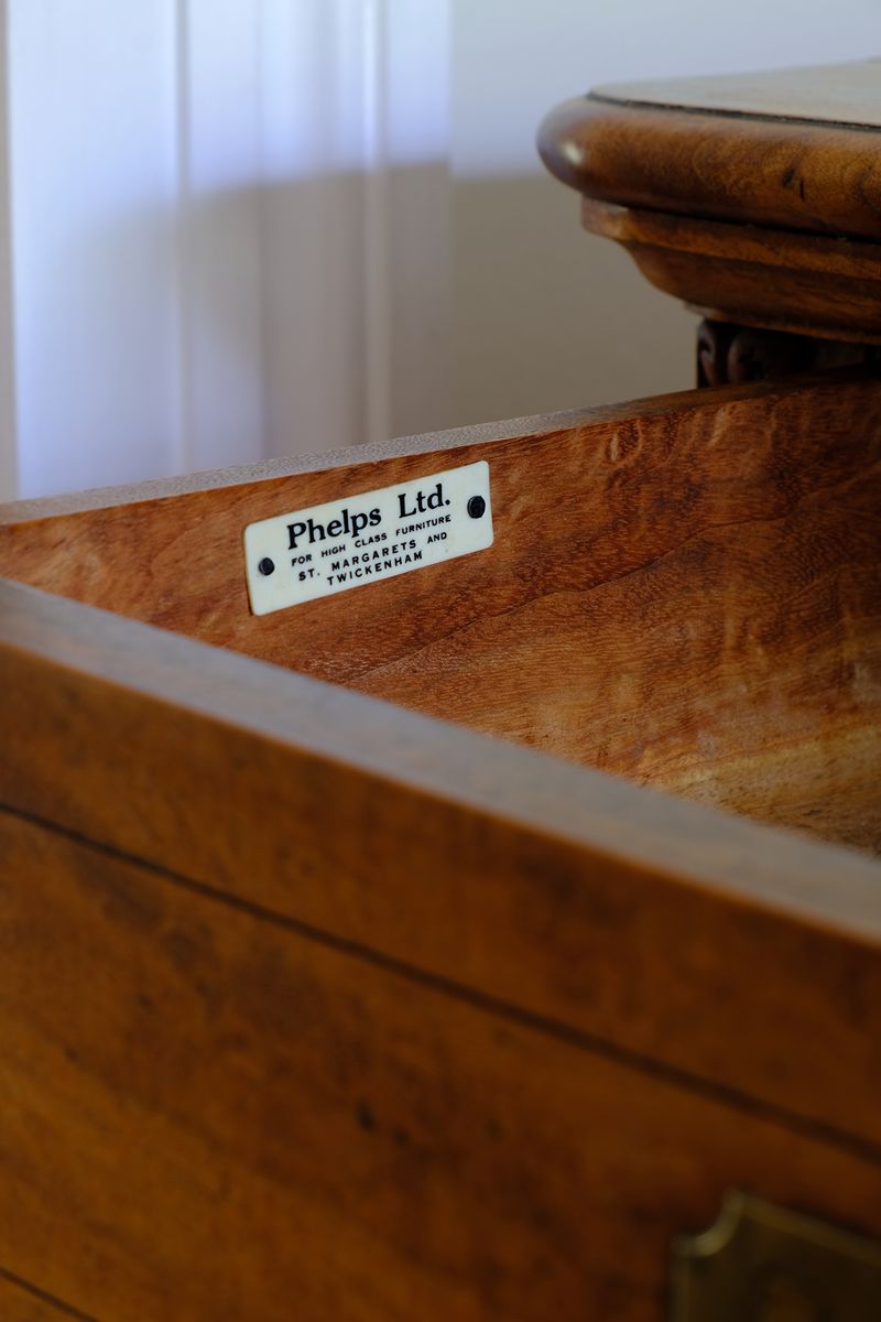 Original ivorine company stamp in this Camphor Wood Campaign Secretaire Chest by Phelps Ltd. with Fitted Writing Desk and Original Label