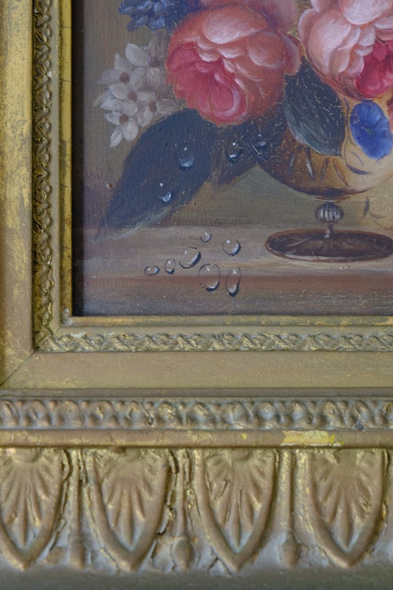 Cloe up of water droplets on an English School antique oil on board still life of garden flowers in original gilt carved frame