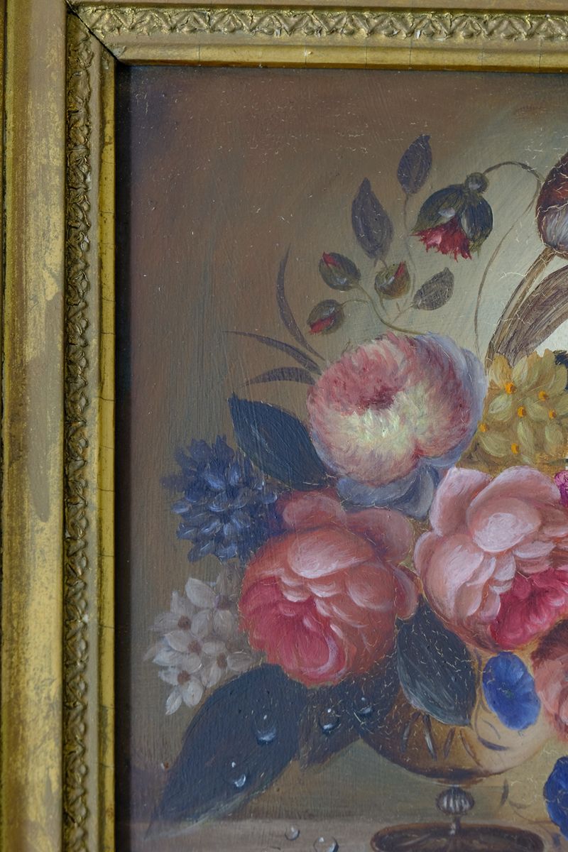 close up of the cut flowers on an English School antique oil on board still life of garden flowers in original gilt carved frame