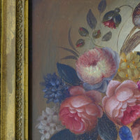 close up of the cut flowers on an English School antique oil on board still life of garden flowers in original gilt carved frame