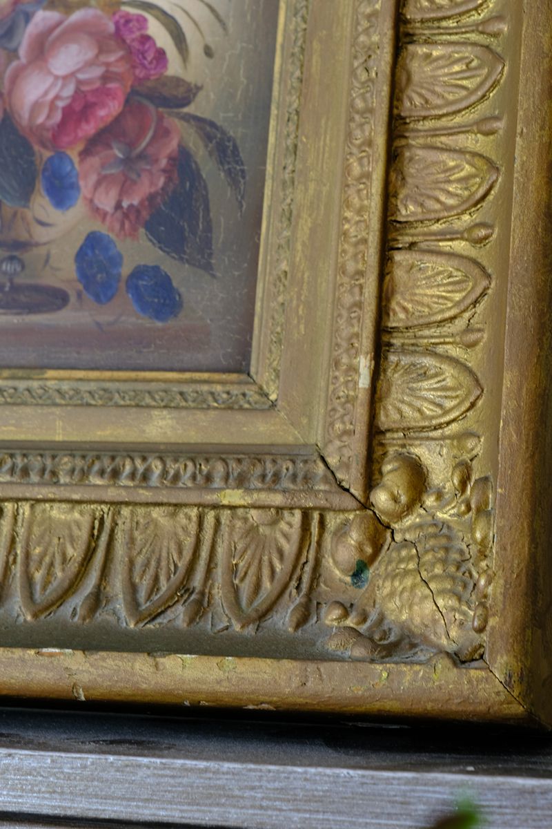 Picture frame moulding detail on a English School antique oil on board still life of garden flowers in original gilt carved frame