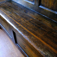 Seat close up on a 19th Century Welsh Oak Settle Bench with Painted Panels and Storage Chest