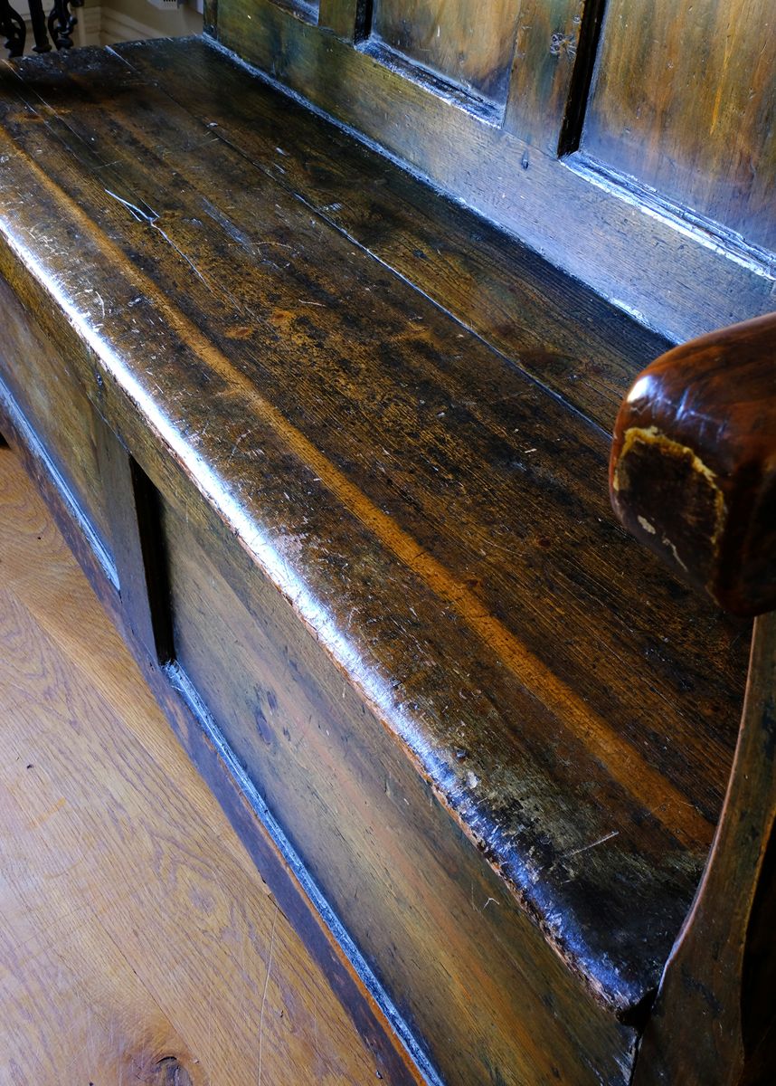 Seat detail on a 19th Century Welsh Oak Settle Bench with Painted Panels and Storage Chest