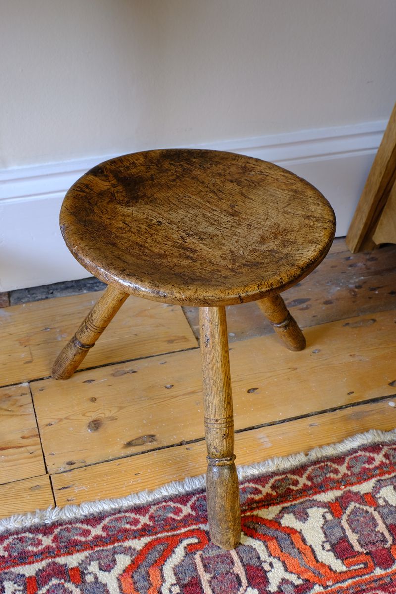 Top view in an 19th Century Vernacular Three Legged Sycamore Dairy Stool with Dished Seat