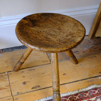 Top view in an 19th Century Vernacular Three Legged Sycamore Dairy Stool with Dished Seat