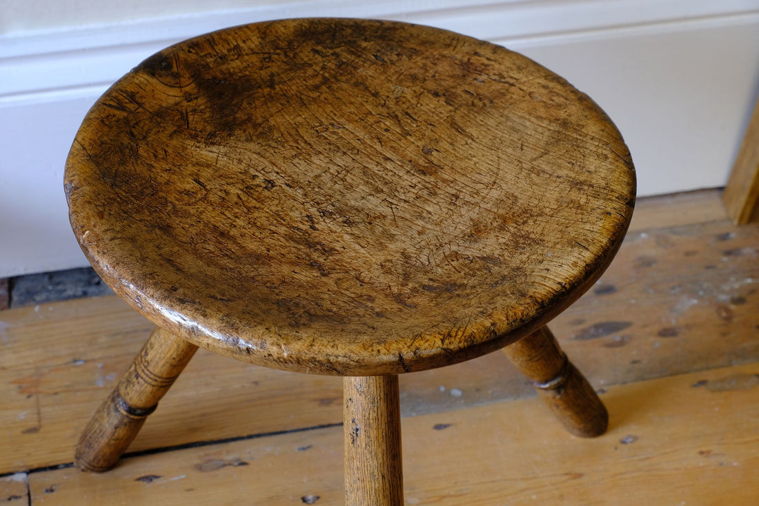 Dished trop on an Early 19th Century Vernacular Three Legged Sycamore Dairy Stool with Dished Seat