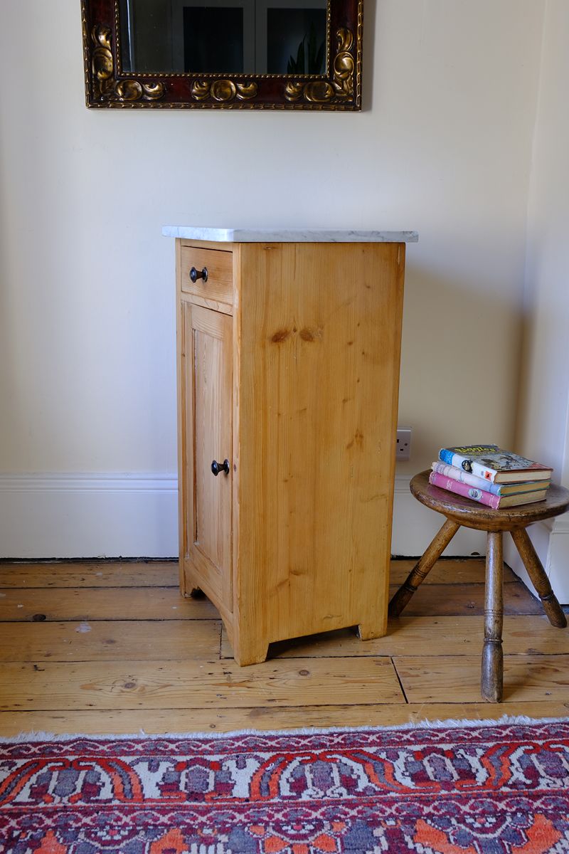 Side cut single panel on a Late Victorian pine marble top bedside cupboard with Carrara marble and concealed brass pivot hinges