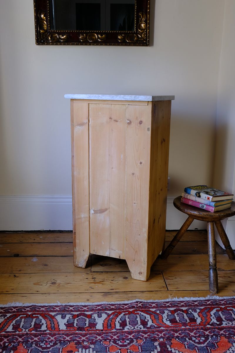 Rear view of a Late Victorian pine marble top bedside cupboard with Carrara marble and concealed brass pivot hinges