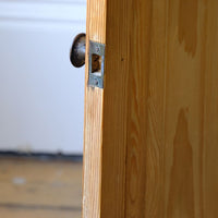 recessed catch receiver on a Late Victorian pine marble top bedside cupboard with Carrara marble and concealed brass pivot hinges