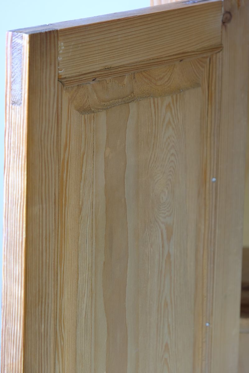 Raised and fielded solid inside door panel on a Late Victorian pine marble top bedside cupboard with Carrara marble and concealed brass pivot hinges