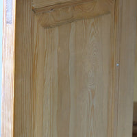 Raised and fielded solid inside door panel on a Late Victorian pine marble top bedside cupboard with Carrara marble and concealed brass pivot hinges