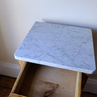 Veined marble top on a Late Victorian pine marble top bedside cupboard with Carrara marble and concealed brass pivot hinges