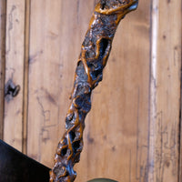 Folk art walking stick in a naturalist root wood form