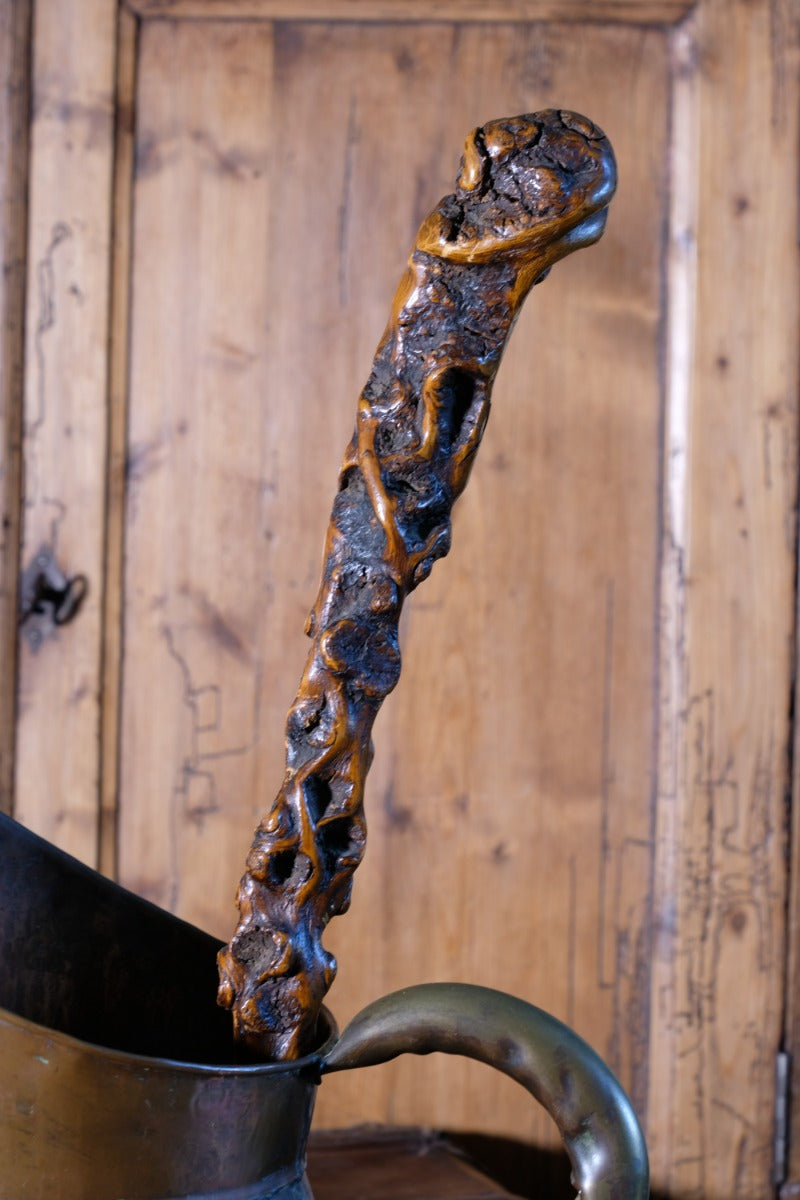 Folk art walking stick in a naturalist root wood form