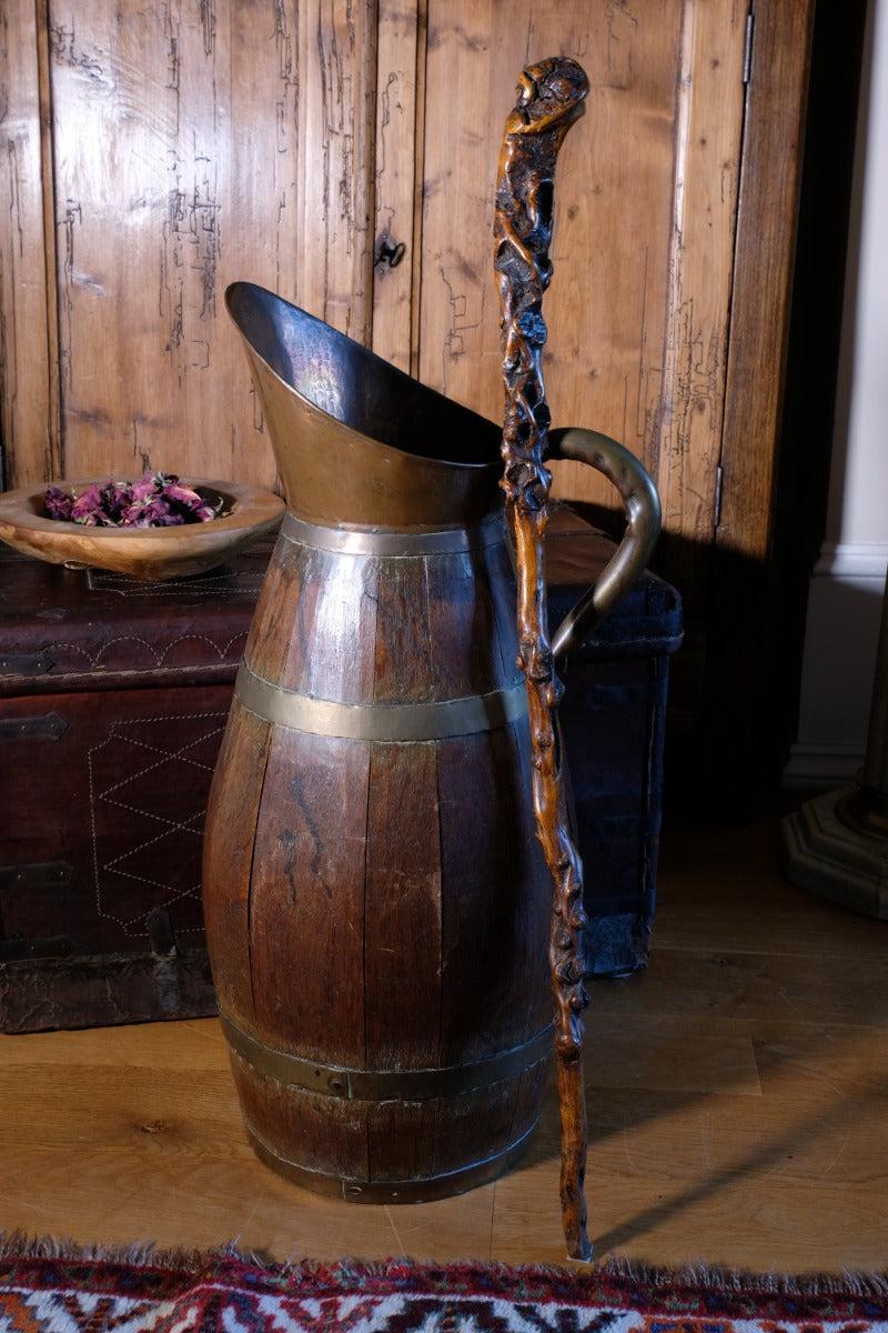 Folk art walking stick in a naturalist root wood form