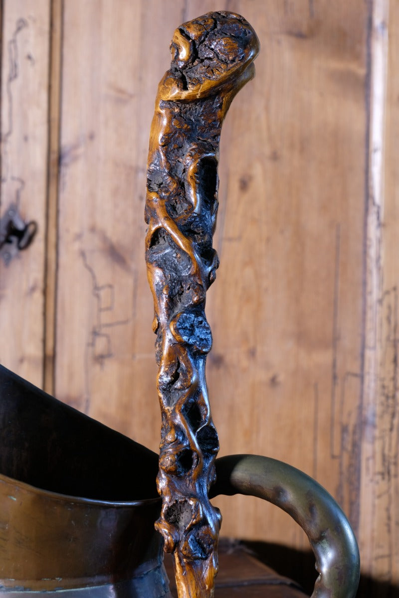 Folk art walking stick in a naturalist root wood form