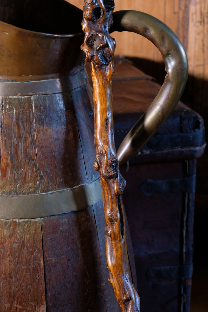 Folk art walking stick in a naturalist root wood form