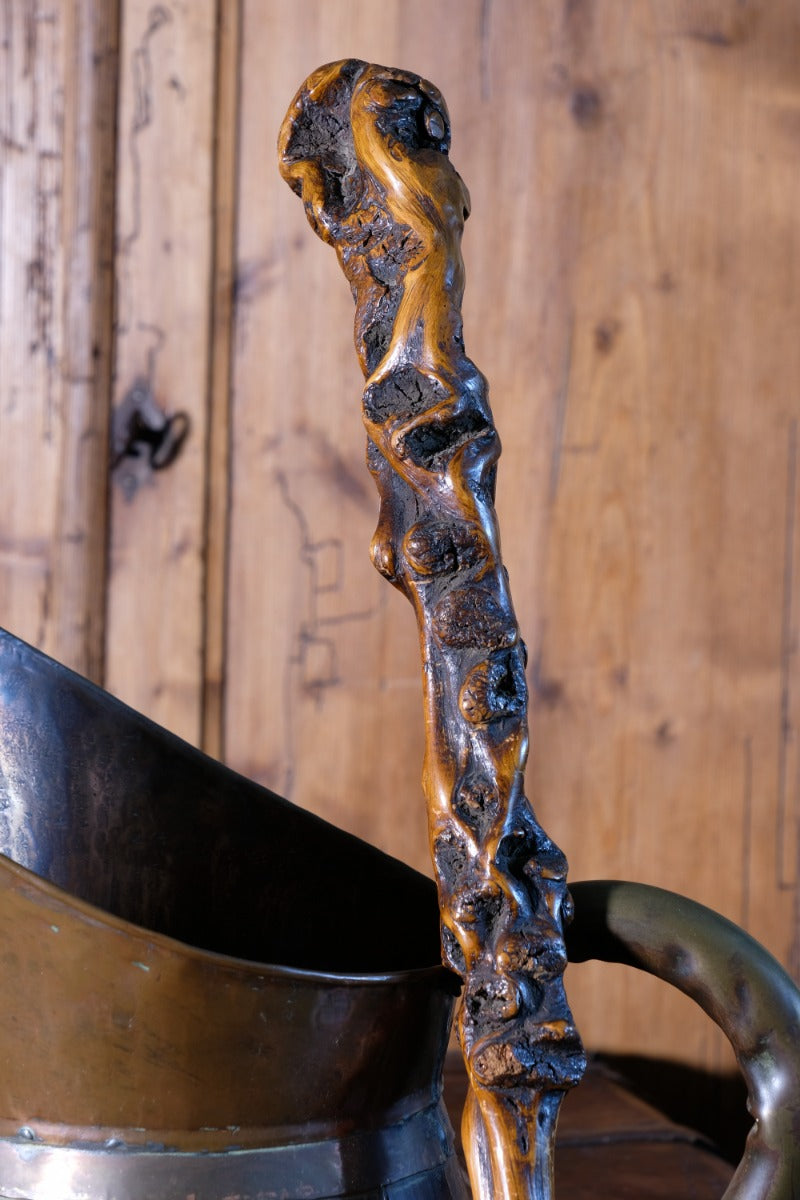 Folk art walking stick in a naturalist root wood form