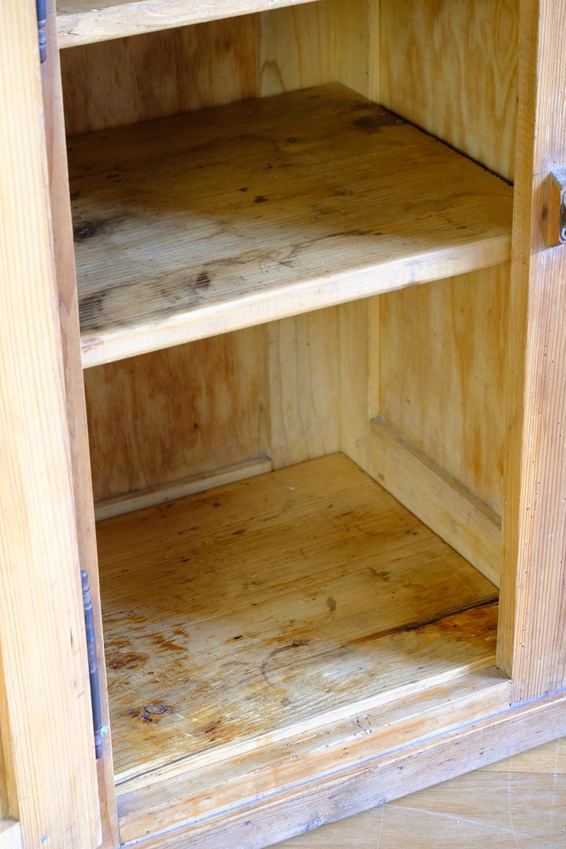 Inside view of the thick patina and marks on the shelves on an Early 20th Century Pitch Pine Single Door Larder Cupboard with Lift-Off Hinges and Original Sprung Latch