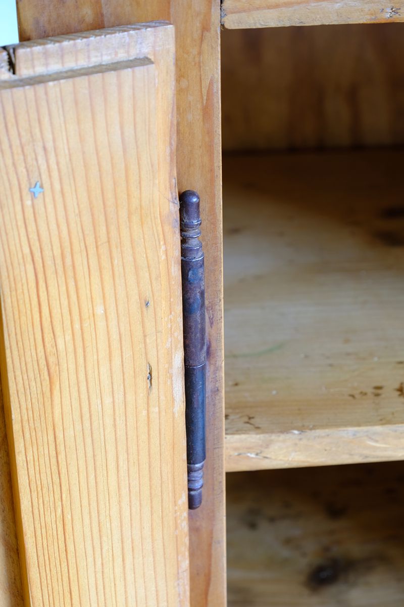 Close up view of the lift off hinge system on an Early 20th Century Pitch Pine Single Door Larder Cupboard with Lift-Off Hinges and Original Sprung Latch