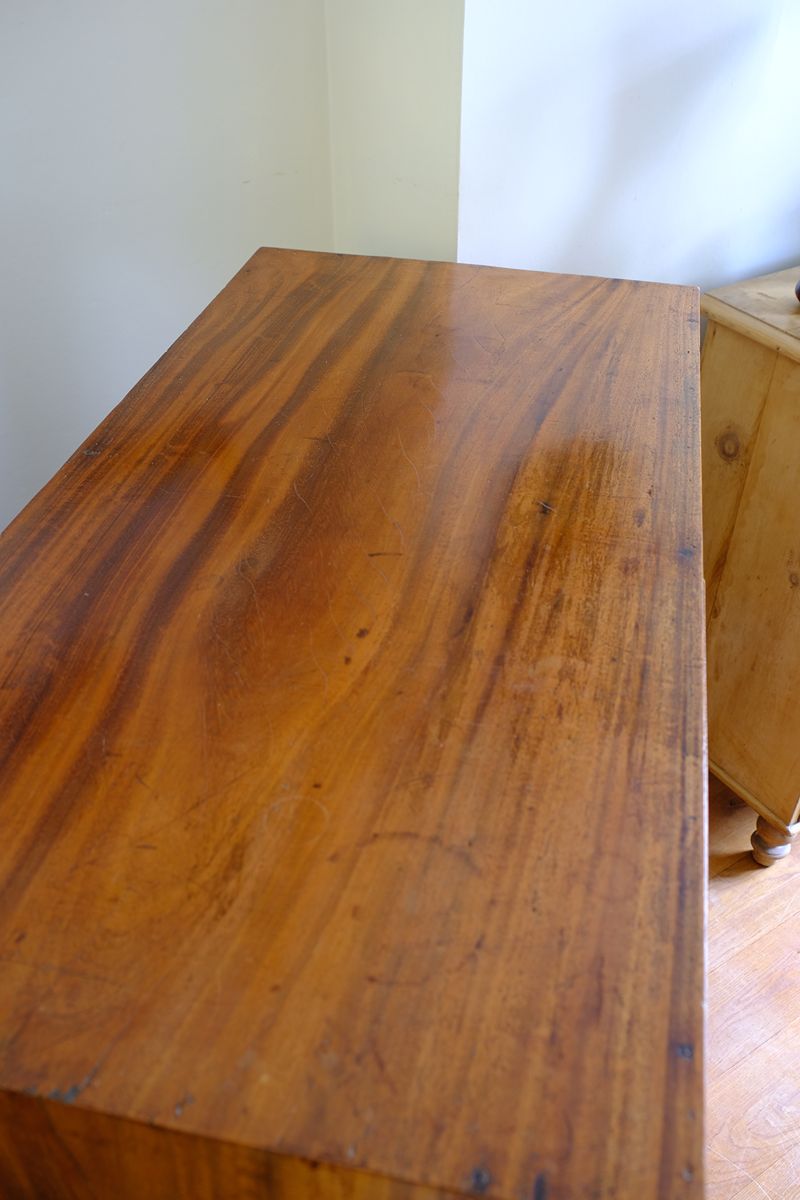 Padauk top on a Late Georgian Anglo-Chinese Padauk Chest of Drawers with Mitred Face Frame and Original Brass Side Carrying Handles