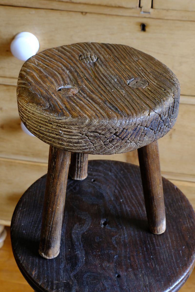 weathered top of the Early 20th Century Elm Milking Stool with Thick Weathered Seat and Original Patina