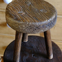 weathered top of the Early 20th Century Elm Milking Stool with Thick Weathered Seat and Original Patina