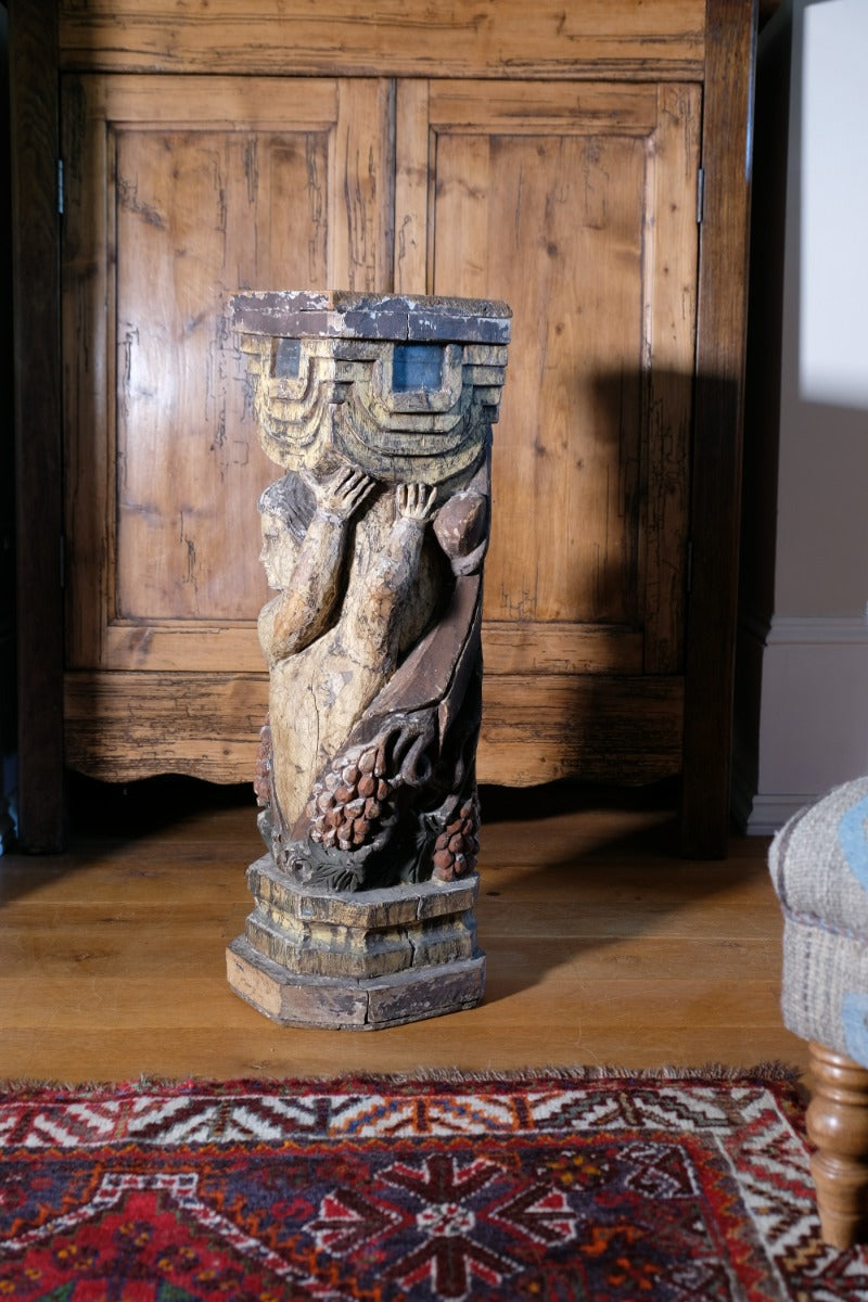 Carved Polychrome Pedestal Sculpture Of A Putto