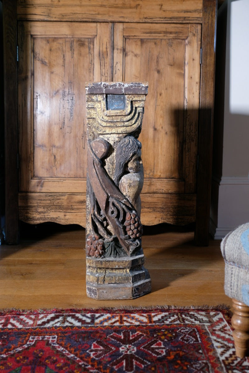 Carved Polychrome Pedestal Sculpture Of A Putto