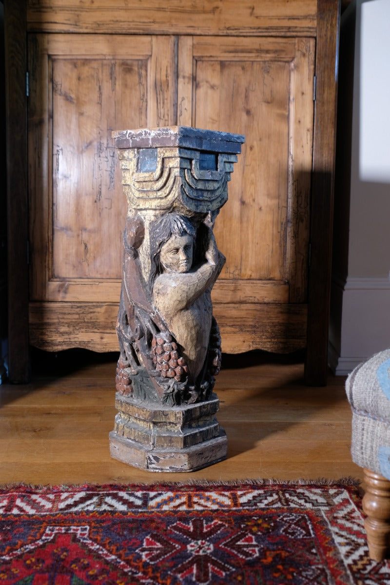 Carved Polychrome Pedestal Sculpture Of A Putto