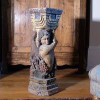 Carved Polychrome Pedestal Sculpture Of A Putto