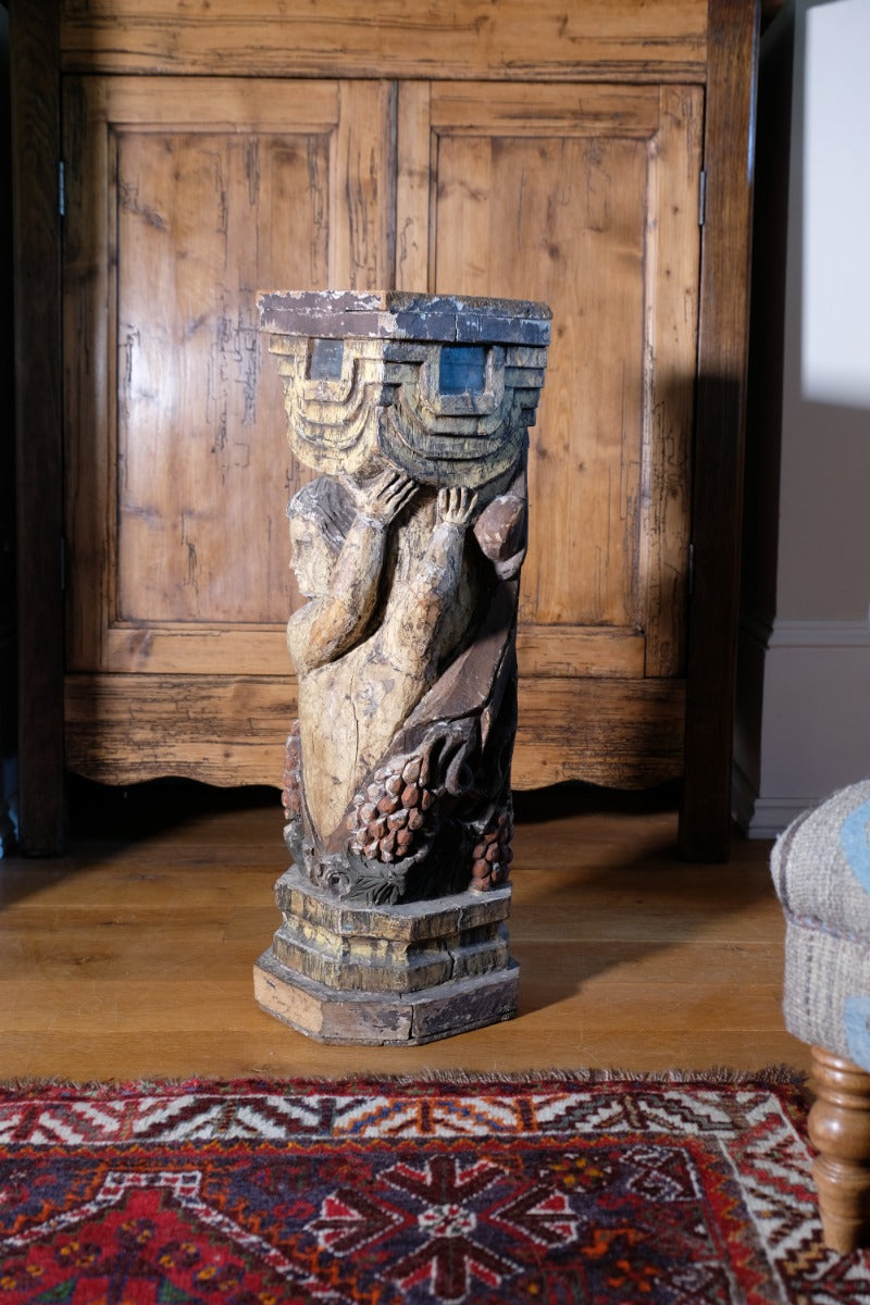 Carved Polychrome Pedestal Sculpture Of A Putto