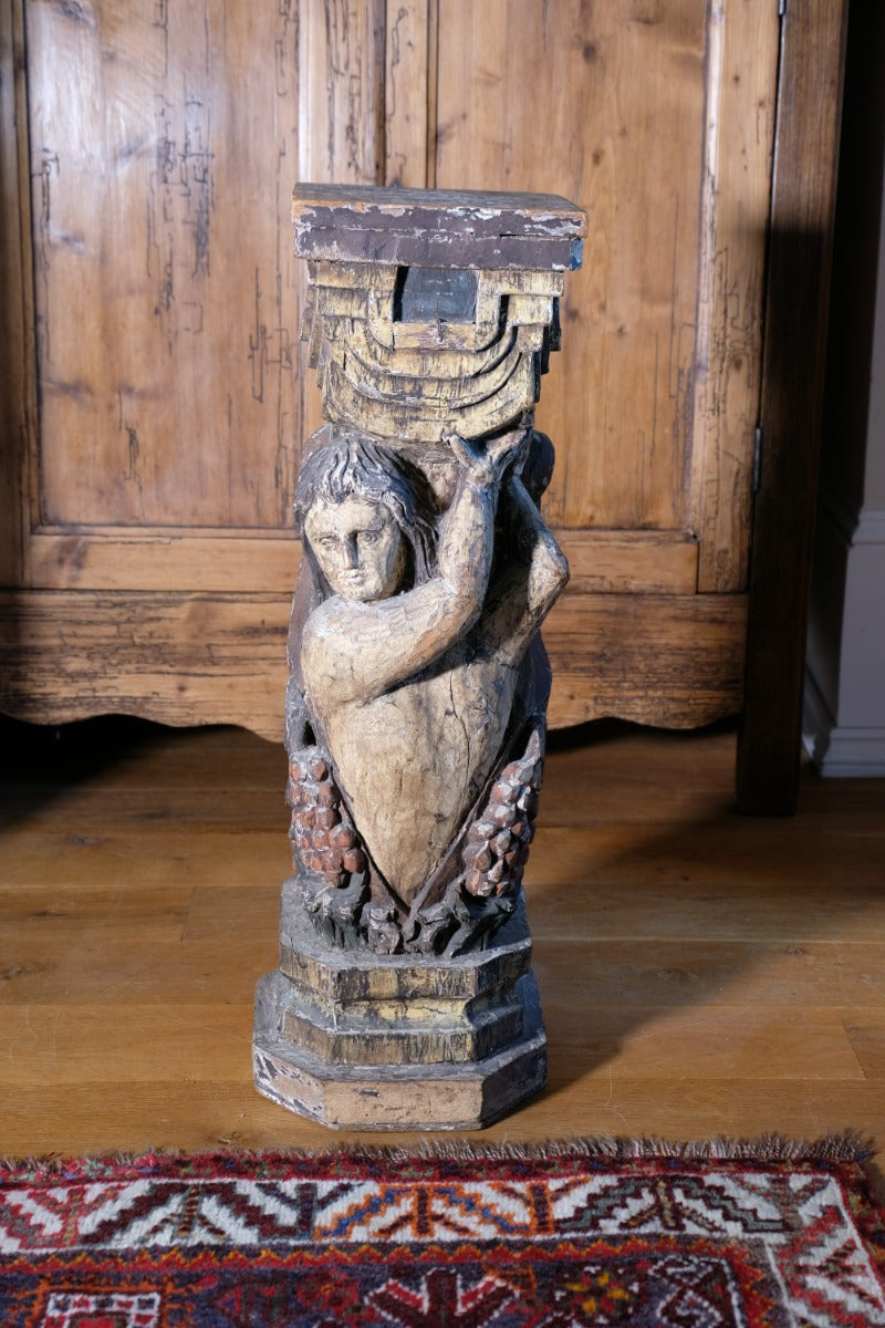 Carved Polychrome Pedestal Sculpture Of A Putto