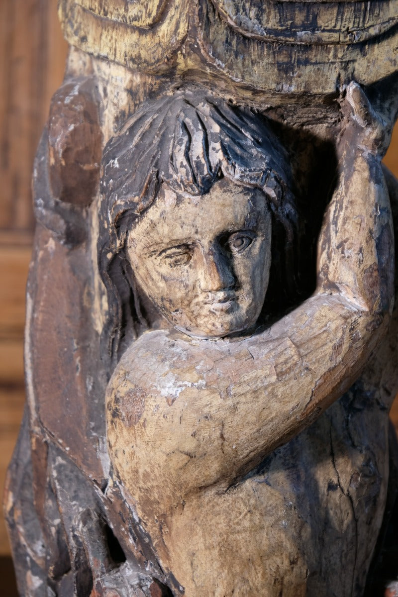 Carved Polychrome Pedestal Sculpture Of A Putto