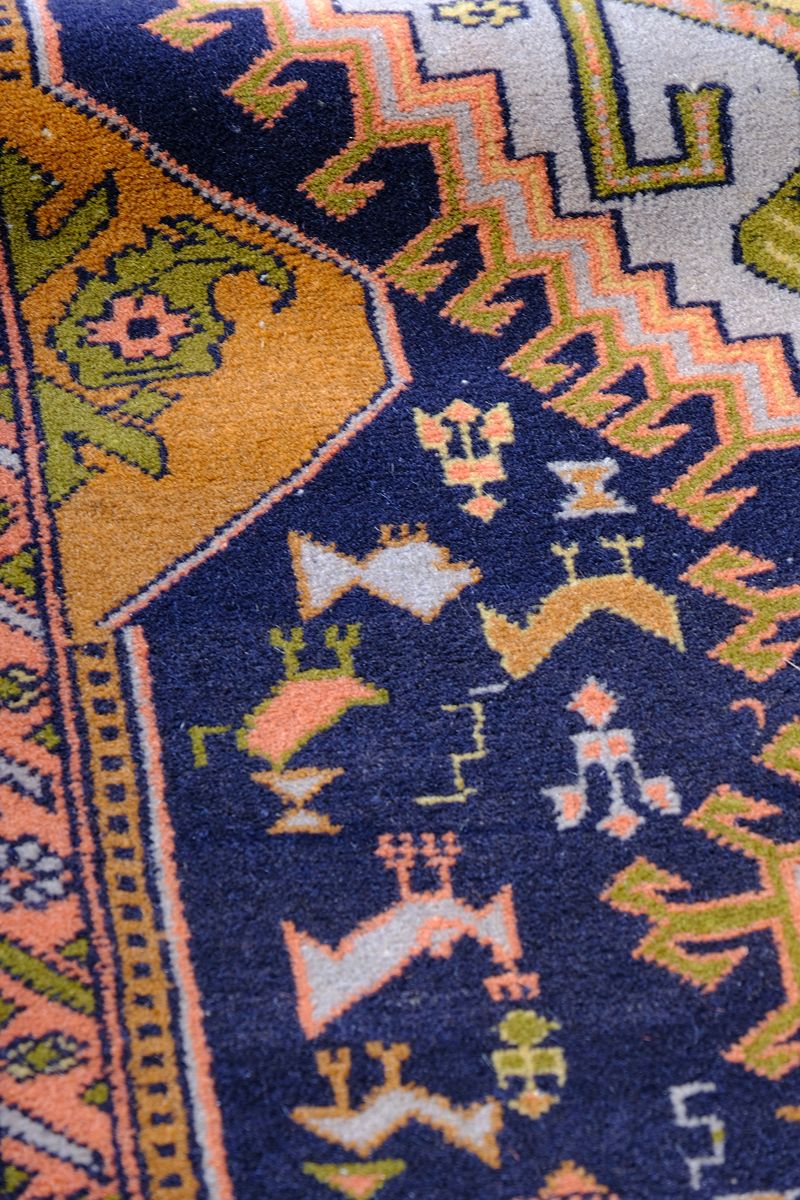 Geometric border detail on an antique Heriz district village hall runner
