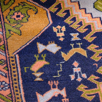 Geometric border detail on an antique Heriz district village hall runner