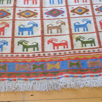 Persian Sumak flatweave rug showing wrapped-weft construction and stylised tribal motifs