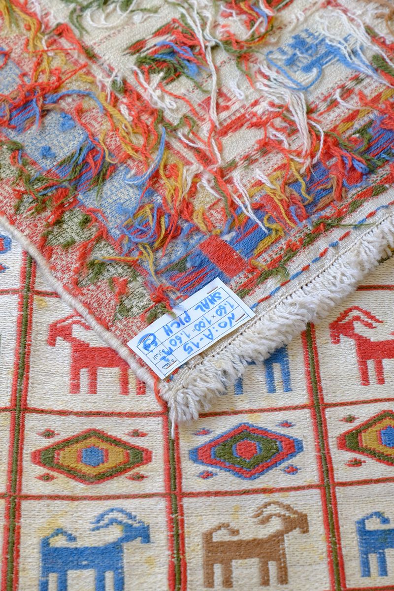 Persian Sumak flatweave rug showing wrapped-weft construction and stylised tribal motifs