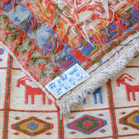 Persian Sumak flatweave rug showing wrapped-weft construction and stylised tribal motifs
